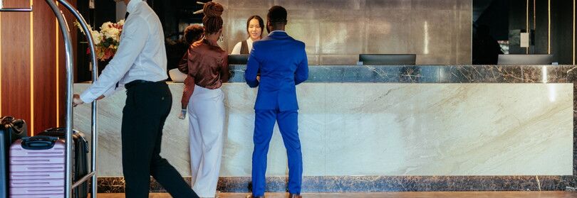 Houston hotel clients registering at reception